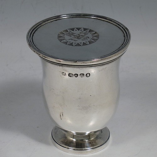 A rare Antique Georgian (William IV) Sterling Silver travelling communion set in the shape of a bell, consisting of a chalice, paten, and silver bottle with stopper. The chalice having a round body with reeded borders, and a gold-gilt interior. The bottle having the same style, but slightly smaller to fit inside the goblet when collapsed, and a pull-off stopper with loop handle. The paten having a round body with a reeded border, and sitting on a collet foot. All three are engraved with a Christogram. Made by Reily and Storer of London in 1830. The dimensions of this fine hand-made antique silver travelling communion set are height (when attached together) 7.5 cms (3 inches), diameter of paten 6.5 cms (2.5 inches), and with a total weight of approx. 192g (6.2 troy ounces).   