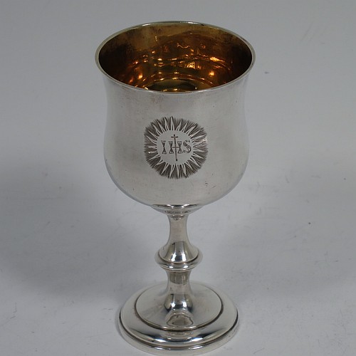 An Antique early Victorian Sterling Silver three-piece travelling communion set consisting of chalice, paten, and wine bottle. The chalice having a plain round bellied body, a gold-gilt interior, and sitting on a pedestal foot. The paten having a round body with an applied reeded and shaped border, and sitting on a collet foot. The wine bottle having a plain rectangular body with cut-corners and round screw-off lid, with a crystal stopper. All three pieces are hand-engraved with a Christogram, and they are all sitting in their original maroon velvet-lined presentation box. Made by John Evans II of London in 1844. The dimensions of this fine hand-made antique silver travelling communion set are height of chalice 9 cms (3.5 inches), diameter of paten 6.5 cms (2.5 inches), length of bottle 8cms (3.25 inches), and with a total weight of approx. 131g (4.2 troy ounces).    