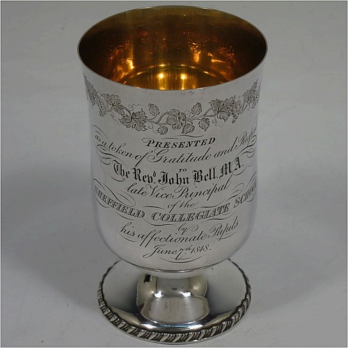 A very unusual and handsome Antique Victorian Silver Plated three-piece travelling communion set consisting of a chalice, paten, and wine bottle. The chalice having a round body with a gold-gilt interior, and sitting on a pedestal foot with a gadroon border. The paten having a round body sitting on a pedestal foot with a gadroon border. The wine bottle having a round body with a flat base and screw-off corked lid. All three pieces are hand-engraved with Christograms and a band of grapevine decoration, and sit in their original dark blue velvet-lined presentation box. All made in ca. 1848, with a contemporaneous inscription on the chalice. The dimensions of this fine hand-made antique silver-plated travelling communion set are height of chalice 10 cms (4 inches), diameter of paten 6.5 cms (2.5 inches), and height of bottle 9.5 cms (3.75 inches).