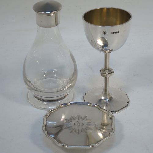 A handsome Antique Victorian Sterling Silver three-piece travelling communion set consisting of a chalice with gold-gilt interior, a paten with an applied shaped border, and a wine bottle with screw-off lid. The chalice and paten made by George Richards and Edward Brown of London in 1865, and the wine bottle by H. F. and Co. Ltd., of London in 1965. The dimensions of this fine antique silver travelling communion set are height of chalice 9 cms (3.5 inches), diameter of paten 7 cms (2.75 inches), height of wine bottle 10 cms (4 inches), with a total  weight of approx. 126g (4 troy ounces). Please note that the chalice and paten have hand engraved christograms. 