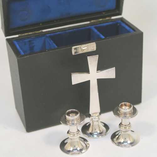 An unusual Silver Plated communion set consisting of two small candlesticks and an altar cross, all in their original dark blue velvet-lined presentation box. All three pieces are hand-made cast and then silver-plated so very durable, and made in the 1950s. The dimensions of this fine hand-made silver-plated travelling communion set are height of altar cross 10 cms (4 inches), diameter of candlesticks 3.5 cms (1.3 inches).   