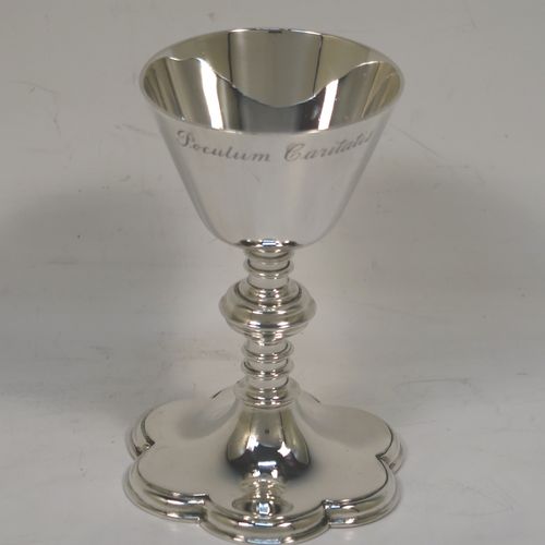 An elegant Antique Victorian Sterling Silver small travelling communion chalice, having a plain round tapering cup, a middle plain round baluster, and sitting on a hexafoil pedestal foot. This beautiful antique silver chalice was made by Blunt and Wray of London in 1897. The dimensions of this fine hand-made silver chalice are height 9 cms (3.5 inches), diameter of cup 5 cms (2 inches), and a weight of approx. 86g (2.8 troy ounces). Please note that this item is engraved with the Latin inscription Poculum Caritatis which stands for The Cup of Kindness. 