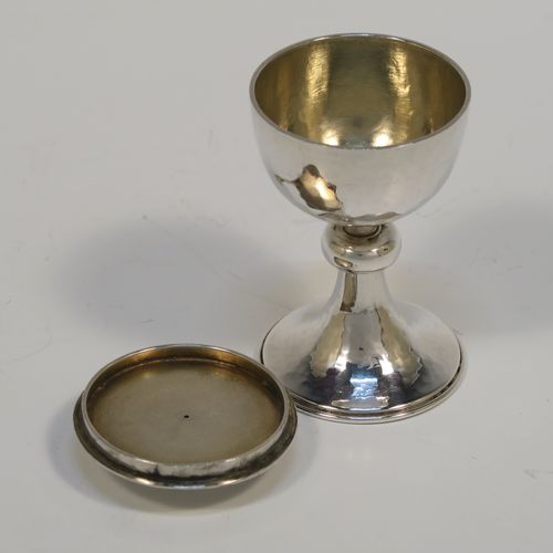 A rare Sterling Silver travelling communion set, consisting of a chalice with pull-off lid and gold-gilt interior, a pyx box with hinged lid, all fitted into a silver-plated cannister style hinged holder with a push-button latch and an applied Christogram on top. This beautiful silver communion set was made by Leonard William Burt of London in 1954. The dimensions of this fine hand-made silver travelling communion set are length of cannister 9 cms (3.5 inches), height of chalice with lid 6.5 cms (2.5 inches), diameter of pyx box 4 cms (1.5 inches), with a total silver weight of approx. 112g (3.6 troy ounces).   