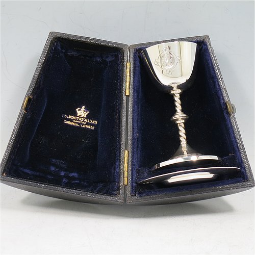 An Antique Victorian Sterling Silver small travelling communion chalice and paten, the chalice having a plain round cup with gold-gilt interior, a twisted stem and central baluster, and sitting on a round pedestal foot with a hand-engraved band of geometrical work. The paten having a plain round body with a hand-chased  ground. All in their original travelling presentation box with dark blue velvet-lined interior. Made by Matthew William White of London in 1888. The dimensions of this fine hand-made antique silver travelling communion set are height of chalice 7.5 cms (3 inches), diameter of paten 6.5 cms (2.5 inches), with a total weight of approx. 56g (1.8 troy ounces). Please note that both the chalice and paten are engraved with a Christogram.   