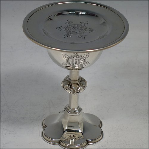 An Antique Victorian Sterling Silver small travelling communion chalice and paten, the chalice having a plain round cup with gold-gilt interior, a central cast baluster, and sitting on a hexafoil pedestal foot. The paten having a plain round body with hand-chased hexafoil ground and an applied rim. Made by the Barnard Brothers of London in 1875 (chalice) and 1878 (paten). The dimensions of this fine hand-made antique silver travelling communion set are height of chalice 9 cms (3.5 inches), diameter of paten 7.5 cms (3 inches), with a total weight of approx. 85g (2.7 troy ounces). Please note that both the chalice and paten are engraved with a Christogram.