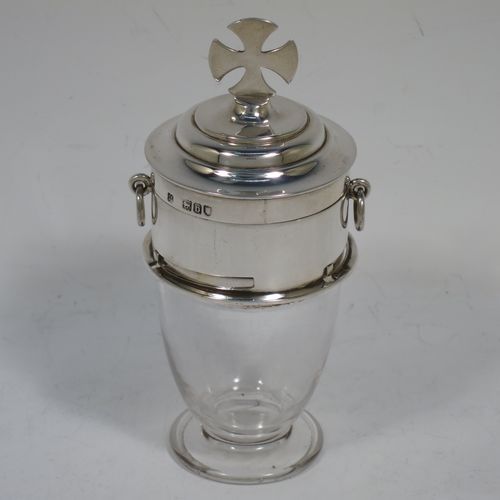 An unusual Antique Victorian Sterling Silver two-piece travelling communion set consisting of a crystal chalice body for consecrated wine (or could be used as a Chrism for holy oil), together with a bayonet fit upper pyx body with a lift-off lid. The lid with an applied cross finial, and the pyx body having a gold-gilt interior with two ring side-handles. Made by Sidney Blunt and Frederick Wray of London in 1897. The dimensions of this fine hand-made antique silver travelling communion set are height 12 cms (4.75 inches), and diameter of main body 5 cms (2 inches).   