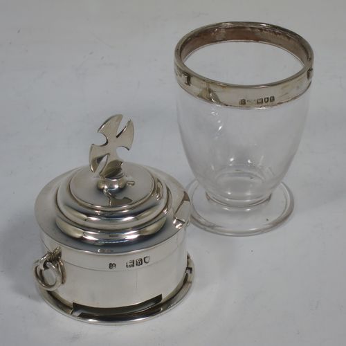 An unusual Antique Victorian Sterling Silver two-piece travelling communion set consisting of a crystal chalice body for consecrated wine (or could be used as a Chrism for holy oil), together with a bayonet fit upper pyx body with a lift-off lid. The lid with an applied cross finial, and the pyx body having a gold-gilt interior with two ring side-handles. Made by Sidney Blunt and Frederick Wray of London in 1897. The dimensions of this fine hand-made antique silver travelling communion set are height 12 cms (4.75 inches), and diameter of main body 5 cms (2 inches).   