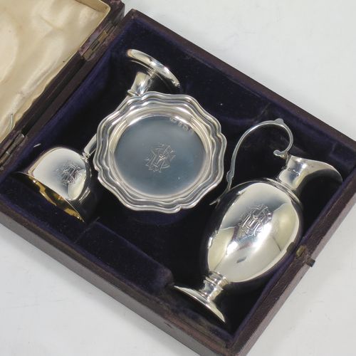 A handsome Antique Edwardian Sterling Silver three-piece travelling communion set consisting of chalice, paten, and wine flagon. In a plain round style, having a gold-gilt interior to the chalice,  an amphora style flagon, and a paten with an applied border and pedestal foot. All the pieces sit in their original cream satin and blue velvet-lined presentation box. Made by Thomas Wooley of Birmingham in 1902. The dimensions of this fine hand-made antique silver travelling communion set are height of flagon 9.5 cms (3.75 inches), diameter of paten 6 cms (2.5 inches), and with a total weight of approx. 113g (3.6 troy ounces). Please note that all items are engraved with a Christogram, and that the flagon does not have a stopper.   