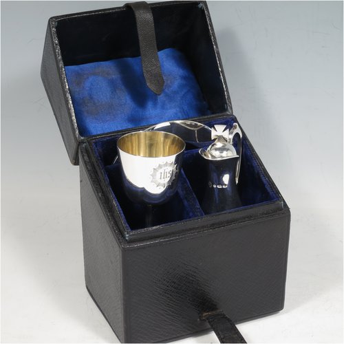 An Antique Victorian Sterling Silver three-piece travelling communion set consisting of chalice, paten, and wine ewer (with pull-off lid and cork seal), having plain round baluster bodies, the chalice with a gold-gilt interior, all having engraved christograms and in their original leather upright presentation box with dark blue velvet and satin-lined interior. Made by Martin & Hall of Sheffield between 1888 to 1890. The dimensions of this fine hand-made antique silver travelling communion set are height of ewer 11 cms (4.25 inches), diameter of paten 8 cms (3.25 inches), and with a total weight of approx. 155g (5 troy ounces).   