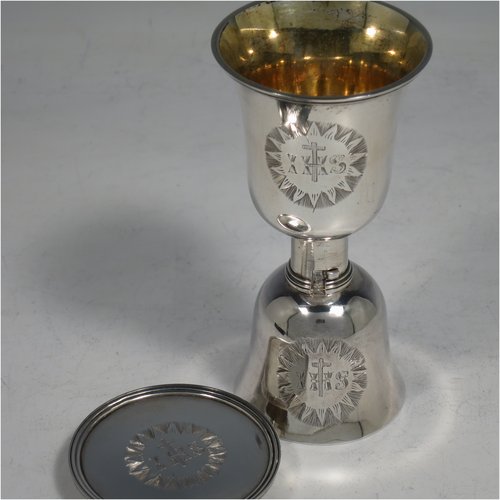 A rare Antique Georgian (William IV) Sterling Silver collapsible travelling communion set, consisting of a chalice, paten, and bottle, with a bayonet-fit mechanism. The chalice having a round body with reeded borders, and a gold-gilt interior. The bottle having the same style, but slightly smaller to fit inside the goblet when collapsed, and a pull-off stopper. The paten having a round body with a reeded border, and sitting on a collet foot. All three are engraved with a Christogram, and all sit in their original maroon velvet-lined and leather presentation box. Made by Charles Rawlings & William Summer of London in 1836. The dimensions of this fine hand-made silver travelling communion set are height (when attached together) 11 cms (4.25 inches), diameter of paten 5 cms (2 inches), and with a total weight of approx. 125g (4 troy ounces).    