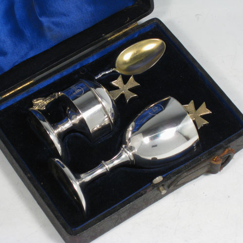 Antique Victorian Scottish sterling silver three-piece travelling communion set consisting of a covered chalice, an annointing spoon, and a ciborium, in original velvet and satin-lined presentation box. Both the chalice and ciborium have sealed lids with cast gold-gilt cruciform handles. The chalice is engraved with Sanguis Christi (blood of Christ), and the ciborium with Corpus Christi (body of Christ). The spoon has a gold-gilt bowl, twisted stem, and a cast figure of Christ. The chalice was made in Edinburgh in 1872, whereas the Ciborium and spoon were made in Glasgow in 1867. Height of chalice 13 cms (5 inches), length of spoon 12 cms (4.75 inches). Total weight approz. 183g (5.9 troy ounces).