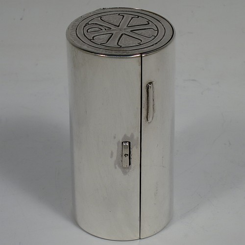 A lovely Arts and Crafts style Sterling Silver travelling communion set with hand-hammered decoration, consisting of a chalice with pull-off lid and gold-gilt interior, the lid also acting as a paten, a pyx box with hinged lid and gold-gilt interior, all fitted into an original silver cannister style hinged holder with a push-button latch and an applied Christogram on top. Made by Greenwood and Watts  of London in 1927. The dimensions of this fine hand-made silver travelling communion set are length of cannister 8.5 cms (3.25 inches), height of chalice with lid 6.5 cms (2.5 inches), diameter of pyx box 3.5 cms (1.3 inches), with a total weight of approx. 212g (6.8 troy ounces). Please note that this item has an In Memorium inscription engraved on the inside of the cannister.    