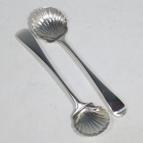 A rare Antique 18th Century Georgian Sterling Silver pair of salt spoons, in the Old English pattern, having hand-chased shell bowls. All made by Richard Crossley of London in 1788. The dimensions of these fine hand-made antique silver salt spoons are length 10 cms (4 inches), and they weigh a total of approx. 38g (1.5 troy ounces).   