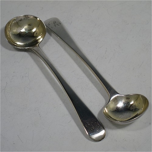 An Antique Georgian Sterling Silver pair of salt spoons, in the Old English pattern, with gold-gilt bowls. Made by Eley and Fern of London in 1814. The dimensions of these fine hand-made antique silver salt spoons are length 10 cms (4 inches), and they weigh a total of approx. 21g (0.7 troy ounces). Please note that these items are monogrammed.  