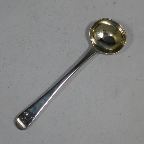 An Antique Georgian Sterling Silver pair of salt spoons, in the Old English pattern, with gold-gilt bowls. Made by Eley and Fern of London in 1814. The dimensions of these fine hand-made antique silver salt spoons are length 10 cms (4 inches), and they weigh a total of approx. 21g (0.7 troy ounces). Please note that these items are monogrammed.  