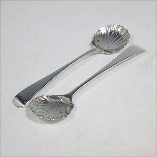 A rare Antique Edwardian Sterling Silver pair of salt spoons, in the Old English pattern, having hand-chased shell bowls. All made by Thomas Bradbury of London in 1905. 