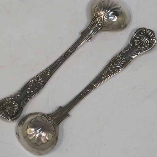 A very elegant and quite large Antique Edwardian Sterling Silver pair of salt spoons, in the double-struck Kings pattern, having gold-gilt bowls. All made by Jackson and Fullerton of London in 1906. The dimensions of these fine hand-made antique silver salt spoons are length 11.5 cms (4.5 inches), and they weigh a total of approx. 42g (1.4 troy ounces).   