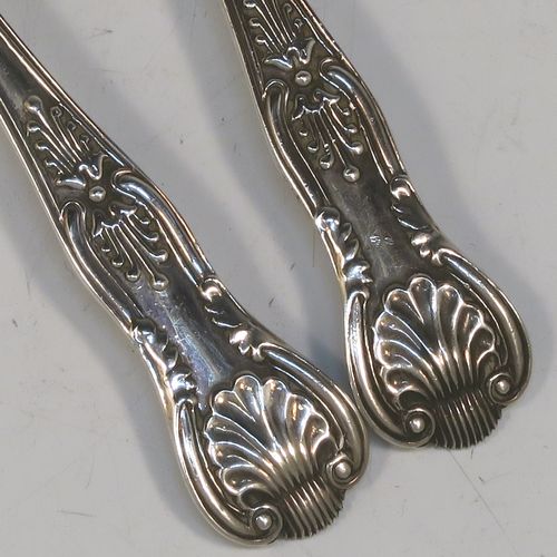 A very elegant and quite large Antique Edwardian Sterling Silver pair of salt spoons, in the double-struck Kings pattern, having gold-gilt bowls. All made by Jackson and Fullerton of London in 1906. The dimensions of these fine hand-made antique silver salt spoons are length 11.5 cms (4.5 inches), and they weigh a total of approx. 42g (1.4 troy ounces).   