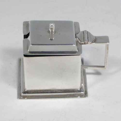 Sterling silver three-piece Art Deco style condiment set, having square cross-section bodies, and consisting of a pepper pot, open salt cellar, and covered mustard, the latter two items with original blue glass liners. Made by William Neale of Birmingham in 1933. The dimensions of this fine hand-made silver condiment service are height of pepper pots 6.5 cms (2.5 inches), length of mustard pot 6 cms (2.3 inches), and the total weight is approx. 127g (4 troy ounces).