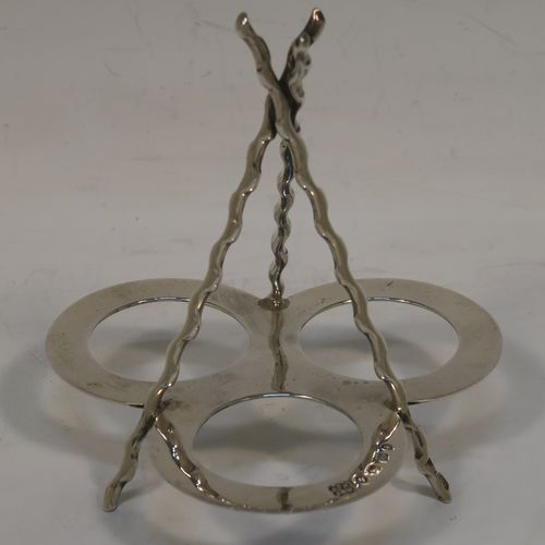 A very pretty and unusual Antique Victorian Sterling Silver Campfire style condiment set, consisting of a pepper shaker, mustard pot, and open salt with panelled cystal bodies and silver tops, all sitting in a campfire style frame with three tree branches joined together. This beautiful antique silver and crystal condiment set was made by Heath and Middleton of Birmingham in 1889. The dimensions of this fine hand-made antique silver condiment set are height 10 cms (4 inches), width 10 cms (4 inches), and it weighs approx. 70g (2.3 troy ounces).  