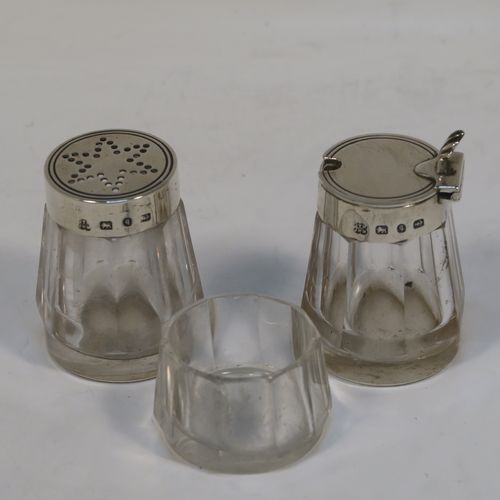 A very pretty and unusual Antique Victorian Sterling Silver Campfire style condiment set, consisting of a pepper shaker, mustard pot, and open salt with panelled cystal bodies and silver tops, all sitting in a campfire style frame with three tree branches joined together. This beautiful antique silver and crystal condiment set was made by Heath and Middleton of Birmingham in 1889. The dimensions of this fine hand-made antique silver condiment set are height 10 cms (4 inches), width 10 cms (4 inches), and it weighs approx. 70g (2.3 troy ounces).  