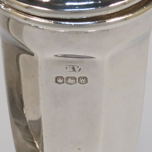 A handsome pair of Sterling Silver salt and pepper shakers, in a panelled Art Deco style, with pull-off lids and sitting on pedestal feet. These elegant silver salt and pepper pots were made by Emile Viner of Sheffield in 1938. The dimensions of this fine hand-made pair of silver pepper and salt shaker pots are height 10 cms (4 inches), diameter of main bodies 3.5 cms (1.3 inches), and the total weight is approx. 94g (3 troy ounces).  