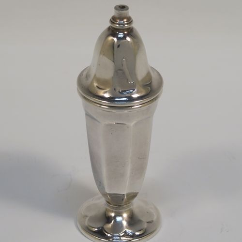 A handsome pair of Sterling Silver salt and pepper shakers, in a panelled Art Deco style, with pull-off lids and sitting on pedestal feet. These elegant silver salt and pepper pots were made by Emile Viner of Sheffield in 1938. The dimensions of this fine hand-made pair of silver pepper and salt shaker pots are height 10 cms (4 inches), diameter of main bodies 3.5 cms (1.3 inches), and the total weight is approx. 94g (3 troy ounces).  