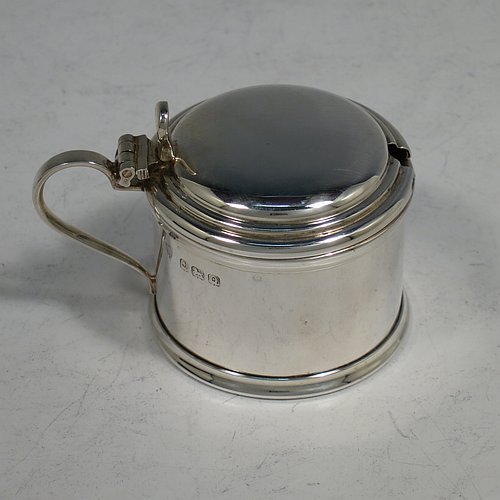 A Sterling Silver three-piece condiment set, in a very plain round Georgian style with applied reeded borders, and consisting of a pepper pot, open salt cellar, and covered mustard pot, the latter two items with original blue glass liners, and all in their original cream satin and black velvet-lined presentation box. Made by J. B Chatterley & Sons Ltd., of Birmingham in 1940. The dimensions of this fine hand-made silver condiment service are height of pepper pot 5.5 cms (2.25 inches), length of mustard pot 6.5 cms (2.5 inches), and the total weight is approx. 93g (3 troy ounces).   