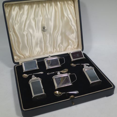 A very handsome Sterling Silver Art Deco six piece condiment service, having octagonal straight-sided bodies, with original blue-glass liners, pull-off lids on the peppers, hinged lids on the mustards, and all in their original dark blue velvet and cream satin-lined presentation box. Consisting of two mustard pots, two pepper pots, two salt cellars, and four condiment spoons. Made by Mappin and Webb of Birmingham in 1928/29. The dimensions of this fine hand-made sterling silver condiment service are height of peppers 7 cms (2.75 inches), length of mustard 6.5 cms (2.5 inches), and a total weight of approx. 190g (6.1 troy ounces). Please note that the silver condiment spoons are made by the Adie Brothers of Birmingham in 1929.   