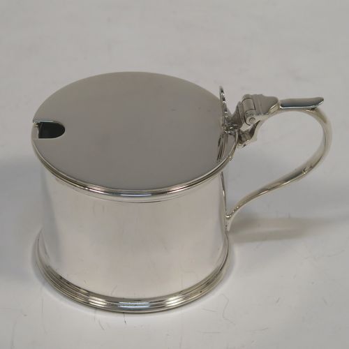 A very handsome Sterling Silver six-piece condiment set, in a very plain round Georgian style with applied reeded borders, and consisting of two pepper pots, two open salt cellars with blue-glass liners, and two covered mustard pots with hinged lids and blue-glass liners, together with two salt spoons and two mustard spoons, and all in their original cream satin and black velvet-lined presentation box. This beautiful silver condiment service was made by S. Blankensee and Sons of Chester and Birmingham in 1939. The dimensions of this fine hand-made silver condiment set are height of pepper pot 7 cms (2.75 inches), length of mustard pot 8 cms (3 inches), and the total weight is approx. 268g (8.6 troy ounces).  