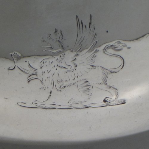 An Antique Victorian sterling silver single large sauce boat, having a plain baluster body, with an applied gadroon border, a cast scroll handle, and sitting on three cast lion-mask feet. Made by Frederick Brasted of London in 1870. The dimensions of this fine hand-made silver sauce boat are length 19.5 cms (7.75 inches), height 11.4 cms (4.5 inches), width 10 cms (4 inches), and it weighs approx. 384g (12.4 troy ounces). Please note that this item is crested.