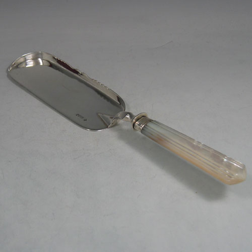    Antique Victorian, sterling silver and mother-of-pearl crumb scoop. Made by Martin & Hall of Sheffield in 1894. Length 31 cms.