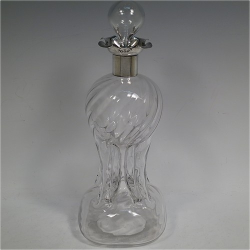 A very pretty Antique Victorian Sterling Silver and cut-crystal glug-glug decanter, having swirl-flute shoulders and clear bottom body, with four pinched and fluted central waists between, a plain round neck mount with four pouring spouts, and a hand-cut spherical crystal stopper. Made by Henry Miller of Birmingham in 1898. The dimensions of this fine hand-made antique silver and crystal glug glug decanter are height 28 cms (11 inches), and width at base 11.5 cms (4.5 inches).   