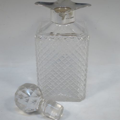 A very handsome Antique Sterling Silver and hand-cut crystal decanter, having a square cross-section body with straight sides and hand-cut hobnail decoration, a plain silver collar with four pouring spouts, and an original hand-cut stopper. Made by the Davies Brothers of Birmingham in 1913. The dimensions of this fine hand-made antique silver and crystal decanter are height 24 cms (9.5 inches), and 9.5 cms (3.75 inches) square.   