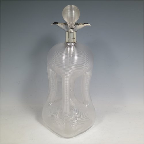 An Antique Victorian large Sterling Silver and cut-crystal glug-glug decanter, having a ribbed body with pinched and fluted central waists, plain round necks with four pouring spouts, and original hand-cut stopper. Made by John N. Mappin of London in 1893. The dimensions of this fine hand-made silver and crystal glug glug decanter are height 29 cms (11.5 inches), and width 13 cms (5 inches).   