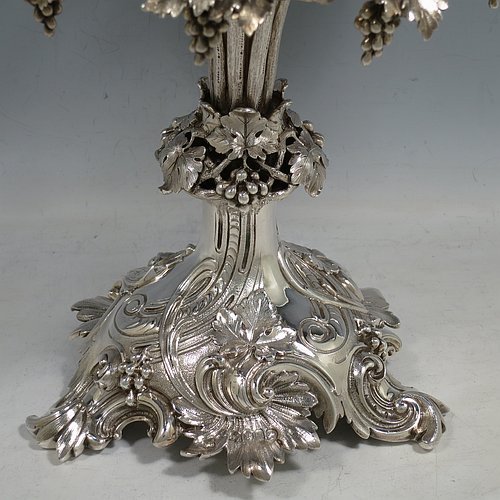 A very pretty Antique Victorian Sterling Silver compote or dessert stand with applied cast grape vine work, and sitting on a pedestal foot with hand-chased anthemion leaves, together with a hand-cut crystal bowl. Made by the Barnard Brothers of London in 1856. The dimensions of this fine hand-made antique silver and crystal dessert or compote stand are height 28 cms (11 inches), diameter of bowl 25.5 cms (10 inches), and it weighs approx. 1,273g (41 troy ounces).   