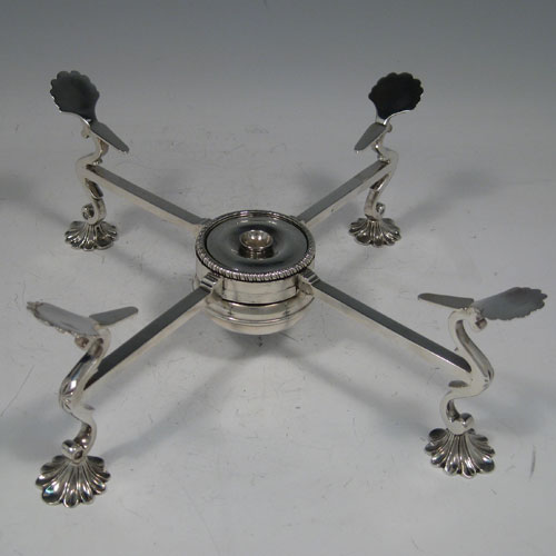 Antique Georgian sterling silver dish-cross stand, having a central burner with gadroon border, rotating square cross-section arms, sitting on four cast shell feet. Made by Joseph Lock of London in 1775. Length 26 cms (10.25 inches). Weight approx. 549g (17.7 troy ounces). Please note that this dish cross has fixed legs.