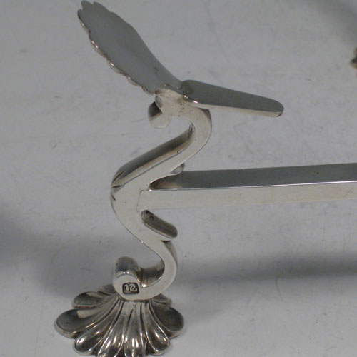 Antique Georgian sterling silver dish-cross stand, having a central burner with gadroon border, rotating square cross-section arms, sitting on four cast shell feet. Made by Joseph Lock of London in 1775. Length 26 cms (10.25 inches). Weight approx. 549g (17.7 troy ounces). Please note that this dish cross has fixed legs.