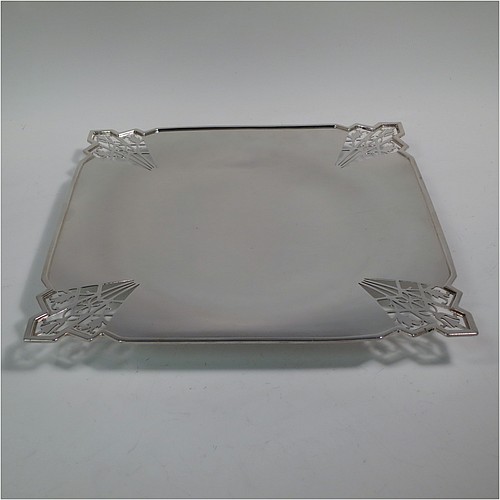 A Sterling Silver Art Deco very elegant style serving dish, having a square-shaped slightly concave body, with hand-pierced geometrical corners, and sitting on a pedestal foot. Made by Mappin and Webb of Sheffield in 1935. The dimensions of this fine hand-made sterling silver Art Deco dish are 23 cms (9 inches) square, height 2.5 cms (1 inch), and it weighs approx. 430g (13.9 troy ounces).   