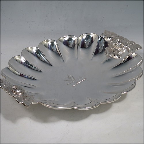 A very pretty Antique Victorian Sterling Silver strawberry dish, having an oval lobed body, with cast and hand-chased handles in the shape of roses, and sitting on a collet foot. Made by William Robert Smily of London in 1853. The dimensions of this fine hand-made antique strawberry table dish are length 24 cms (9.5 inches), width 19 cms ((7.5 inches), height 4 cms (1.5 inches), and it weighs approx. 316g (10.2 troy ounces).
	   