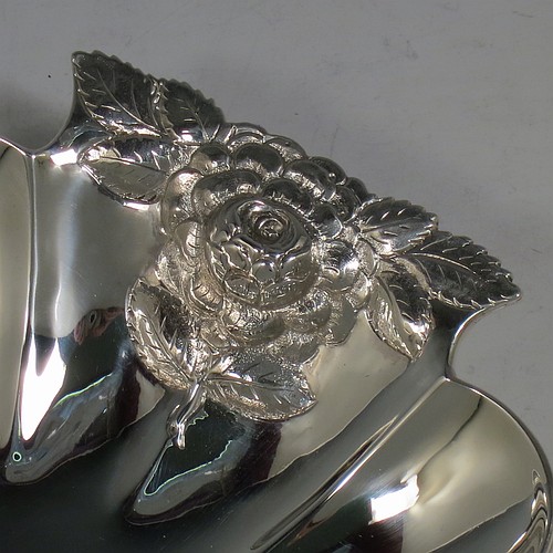 A very pretty Antique Victorian Sterling Silver strawberry dish, having an oval lobed body, with cast and hand-chased handles in the shape of roses, and sitting on a collet foot. Made by William Robert Smily of London in 1853. The dimensions of this fine hand-made antique strawberry table dish are length 24 cms (9.5 inches), width 19 cms ((7.5 inches), height 4 cms (1.5 inches), and it weighs approx. 316g (10.2 troy ounces).
	   