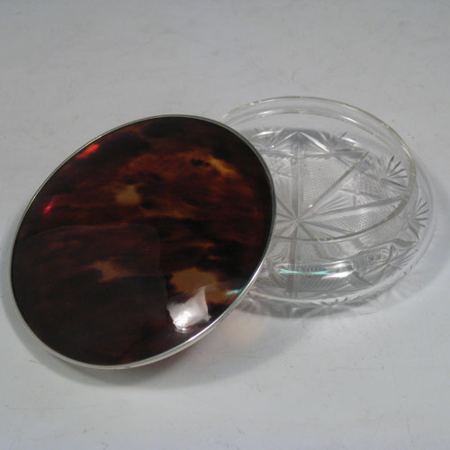    Sterling silver and tortoise-shell dressing table jar with pull-off lid and hand-cut crystal body. Made in Birmingham in 1925. Diameter 10 cms (4 inches), height 4 cms (1.5 inches).