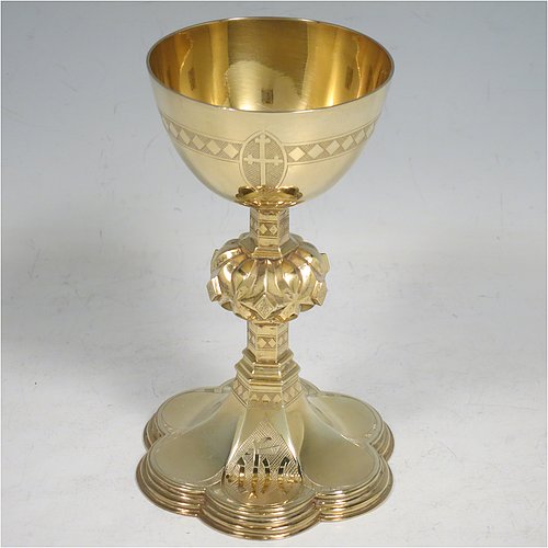 An Antique Victorian Sterling Silver and Gold Gilt small communion chalice, having a round cup with a hand-engraved band of diamond shapes, a middle baluster with hand-chased diamond shaped decoration, and all sitting on a spreading hexafoil foot engraved with a Christogram. Made by John Keith of London in 1855. The dimensions of this fine hand-made antique silver chalice are height 12.5 cms (5 inches), width at base 8 cms (3 inches), and it weighs approx. 125g (4 troy ounces).   