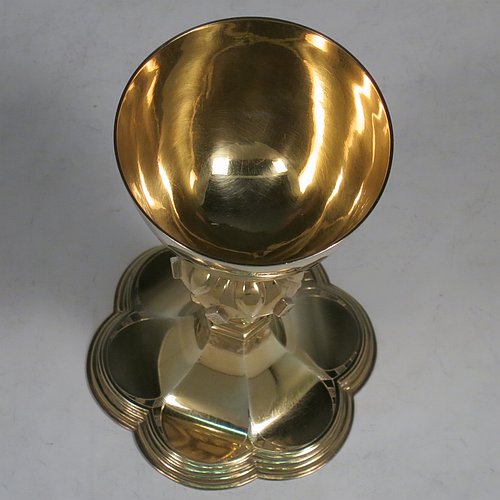 An Antique Victorian Sterling Silver and Gold Gilt small communion chalice, having a round cup with a hand-engraved band of diamond shapes, a middle baluster with hand-chased diamond shaped decoration, and all sitting on a spreading hexafoil foot engraved with a Christogram. Made by John Keith of London in 1855. The dimensions of this fine hand-made antique silver chalice are height 12.5 cms (5 inches), width at base 8 cms (3 inches), and it weighs approx. 125g (4 troy ounces).   