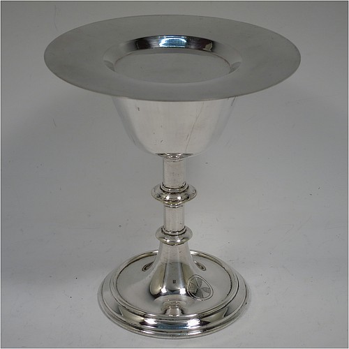 An Antique Edwardian Silver-Plated altar chalice and paten, having a plain round tapering cup with gold-gilt interior, a round column with a middle baluster, and a spreading pedestal foot, together with a plain round original paten. Made by Pratt and Sons of London in circa 1910. The dimensions of this fine hand-made antique silver plated chalice & paten are height 14.5 cms (5.75 inches), and diameter of paten 12.5 cms (5 inches).    