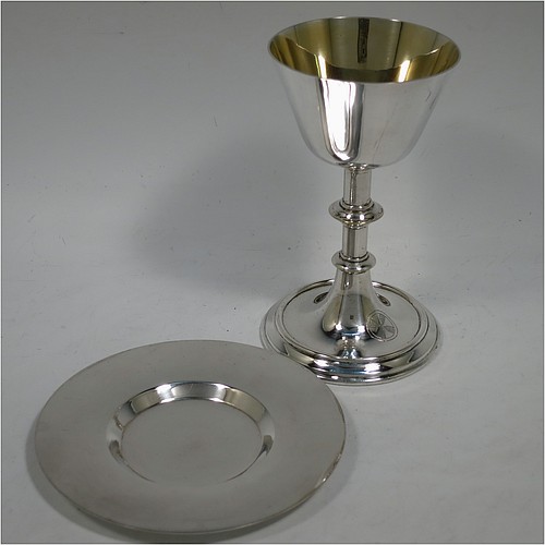 An Antique Edwardian Silver-Plated altar chalice and paten, having a plain round tapering cup with gold-gilt interior, a round column with a middle baluster, and a spreading pedestal foot, together with a plain round original paten. Made by Pratt and Sons of London in circa 1910. The dimensions of this fine hand-made antique silver plated chalice & paten are height 14.5 cms (5.75 inches), and diameter of paten 12.5 cms (5 inches).    