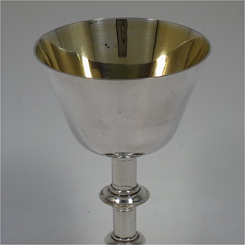 An Antique Edwardian Silver-Plated altar chalice and paten, having a plain round tapering cup with gold-gilt interior, a round column with a middle baluster, and a spreading pedestal foot, together with a plain round original paten. Made by Pratt and Sons of London in circa 1910. The dimensions of this fine hand-made antique silver plated chalice & paten are height 14.5 cms (5.75 inches), and diameter of paten 12.5 cms (5 inches).    