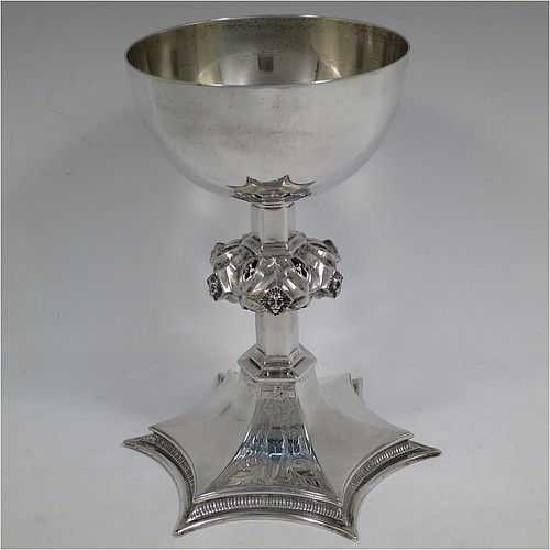 A large and heavy Antique Edwardian Sterling Silver altar chalice, having a plain round bellied cup, an octagonal column with middle baluster having hand-pierced decoration and applied leopards heads, and a spreading concave octagonal foot with a gadroon lower borer. Made by Frederick Wray of London in 1910. The dimensions of this fine hand-made antique silver altar chalice are height 20 cms (8 inches), diameter of cup 12cms (4.75 inches), across foot 16 cms (6.3 inches), and it weighs approx. 584g (18.8 troy ounces).    