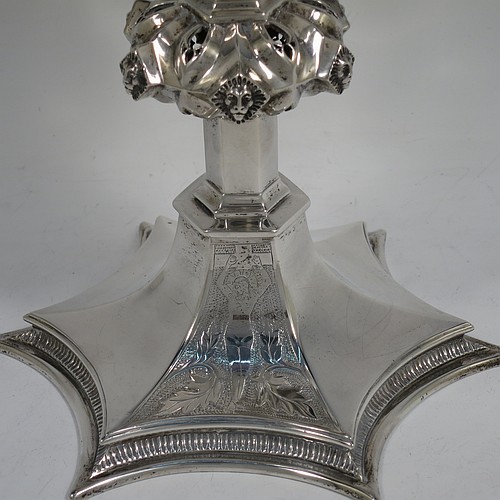 A large and heavy Antique Edwardian Sterling Silver altar chalice, having a plain round bellied cup, an octagonal column with middle baluster having hand-pierced decoration and applied leopards heads, and a spreading concave octagonal foot with a gadroon lower borer. Made by Frederick Wray of London in 1910. The dimensions of this fine hand-made antique silver altar chalice are height 20 cms (8 inches), diameter of cup 12cms (4.75 inches), across foot 16 cms (6.3 inches), and it weighs approx. 584g (18.8 troy ounces).    