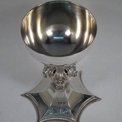 A large and heavy Antique Edwardian Sterling Silver altar chalice, having a plain round bellied cup, an octagonal column with middle baluster having hand-pierced decoration and applied leopards heads, and a spreading concave octagonal foot with a gadroon lower borer. Made by Frederick Wray of London in 1910. The dimensions of this fine hand-made antique silver altar chalice are height 20 cms (8 inches), diameter of cup 12cms (4.75 inches), across foot 16 cms (6.3 inches), and it weighs approx. 584g (18.8 troy ounces).    